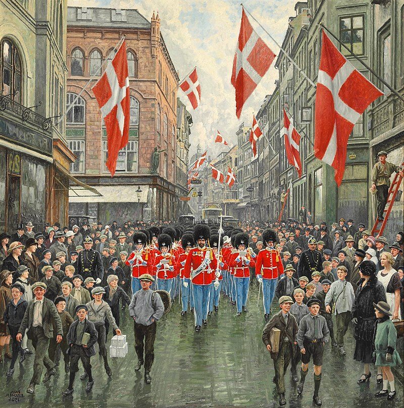 Kongens Fødselsdag (1925), by Paul Fischer reflects a celebratory and patriotic portrayal of the Danish royal family.